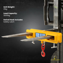 3000kg Forklift Lifting Attachment being used to lift a suspended load in an industrial workshop environment.