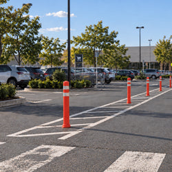 Removable 800mm semi-flexible plastic bollard with a metal-look finish and single surface-fixing center anchor.