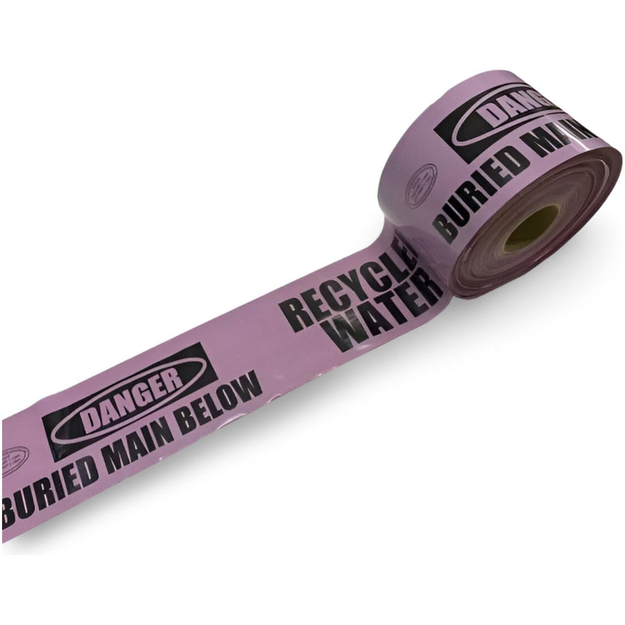 A roll of detectable mains marker tape having lilac color with text 'DANGER BURIED MAIN BELOW RECYCLED WATER' printed in black.