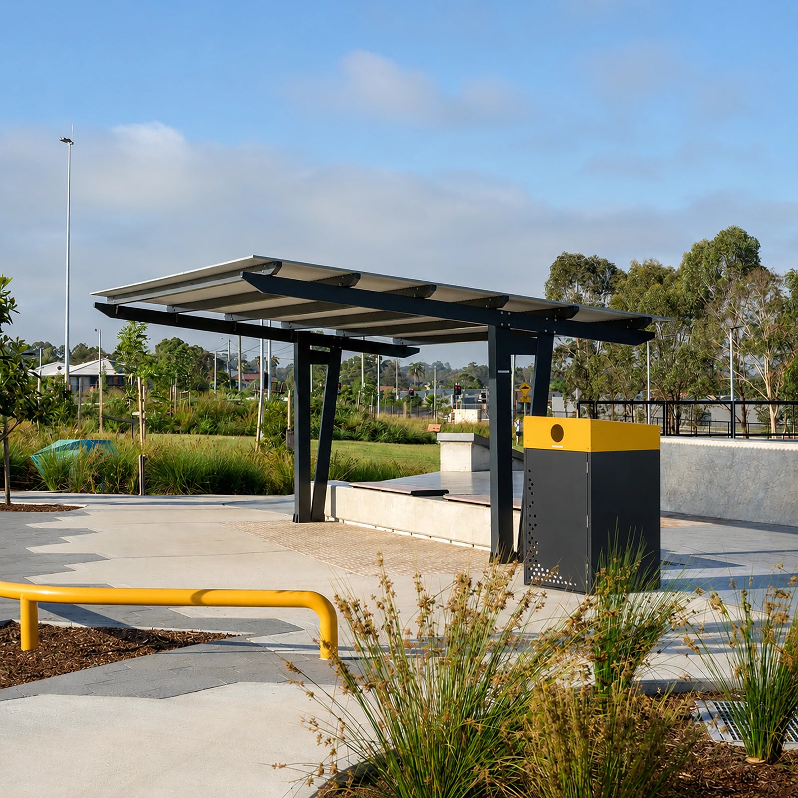 Powdercoated zinc steel 240L wheelie bin enclosure featuring a protective hood, vandal-resistant lock, and bolt-down base.