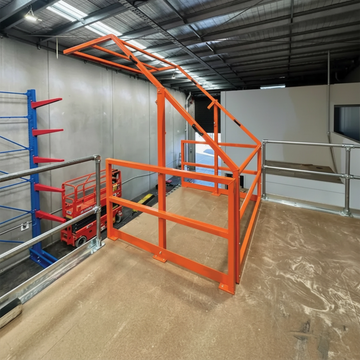 Mezzanine Up & Over Gate, Yellow Warehouse Safety Gate for Pallet Loading and Fall Protection on Mezzanine Levels.