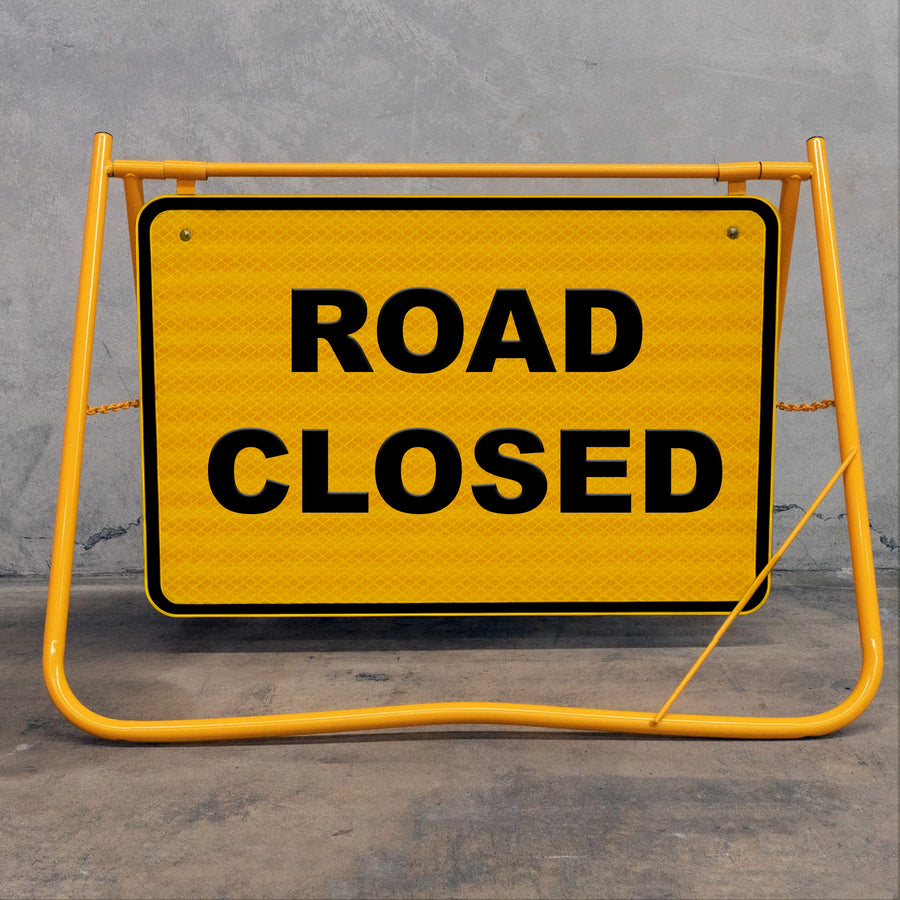 Flat-folding yellow swing stand sign for efficient storage in construction utes and trucks, featuring a removable metal sign face for site versatility.