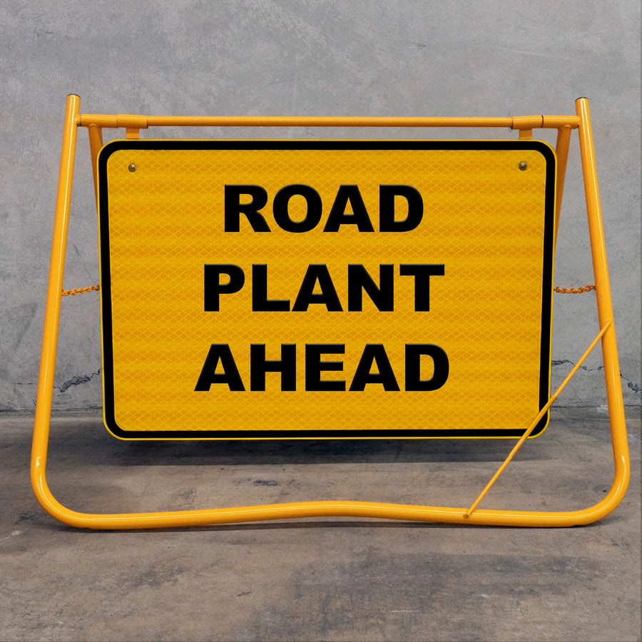 Flat-folding yellow swing stand sign frame for easy transport in construction utes and trucks, featuring a removable metal sign face for site versatility.
