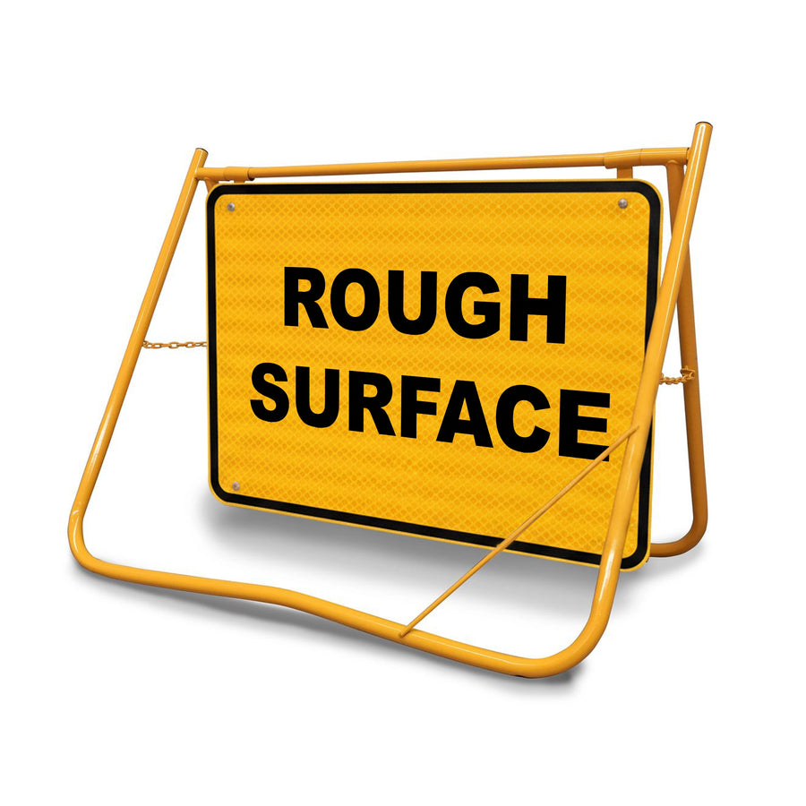 The galvanised steel face features Class 1 Reflective sheeting, ensuring the "Rough Surface" warning remains highly visible to headlights during night-time or low-light weather conditions.