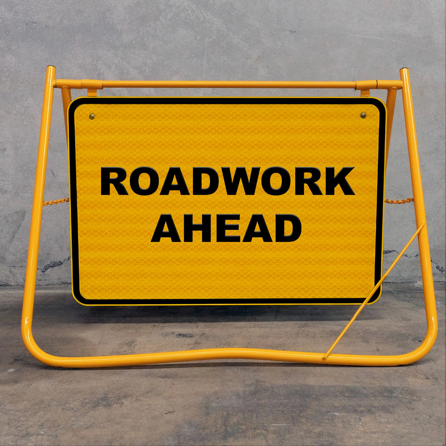 Flat-folding yellow swing stand frame for easy transport in utes and vans, featuring a removable metal sign face and vandal-resistant bolt system.