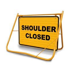 [Shoulder Closed Swing Stand Sign], featuring a Class 1 reflective 900x600mm panel on a yellow folding steel frame.