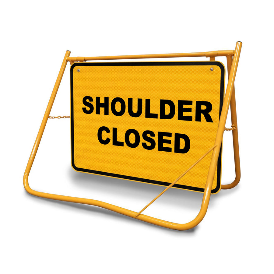 [Shoulder Closed Swing Stand Sign], featuring a Class 1 reflective 900x600mm panel on a yellow folding steel frame.