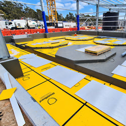 High-impact felt-backed yellow temporary surface protection board designed for sensitive flooring and lift interiors during construction.