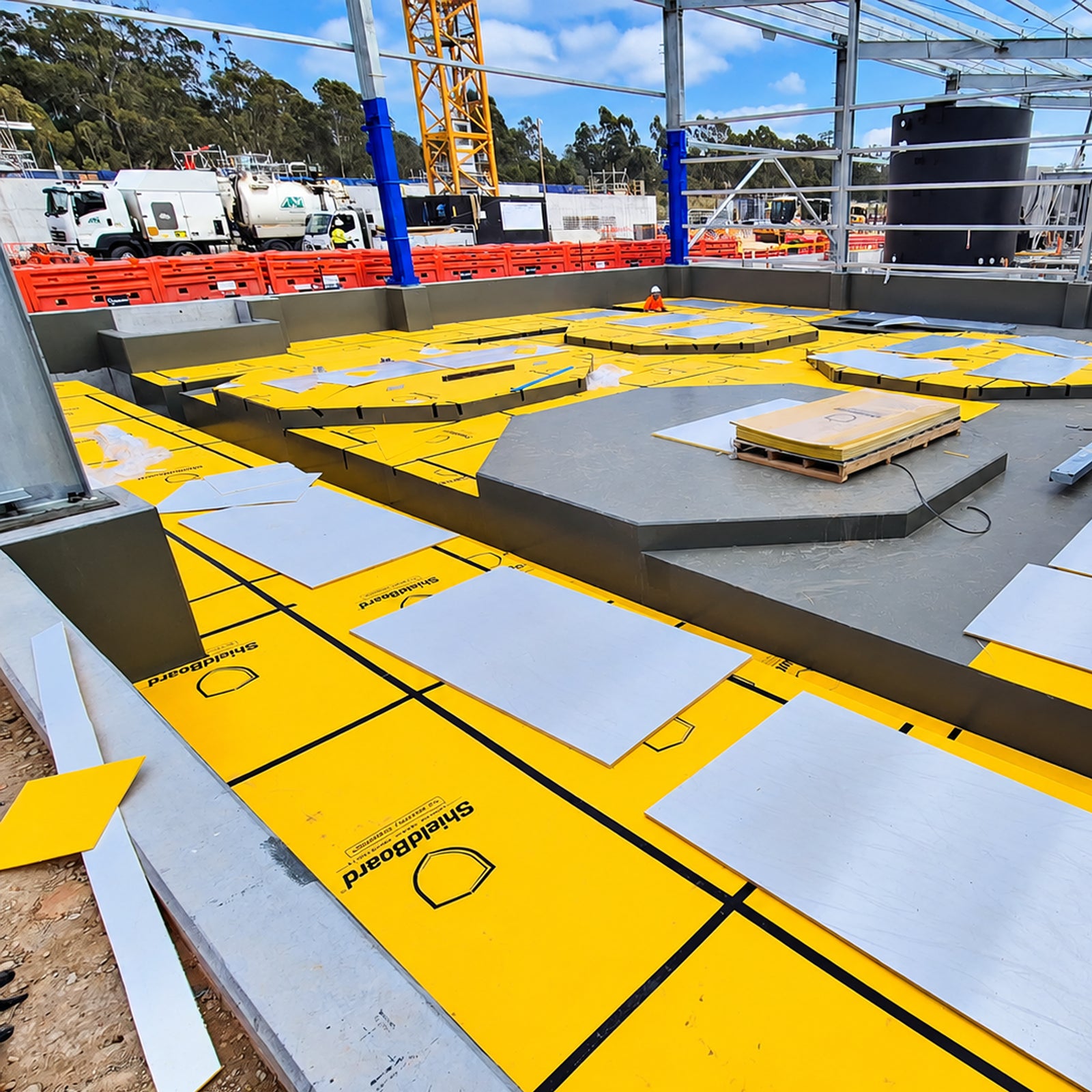 High-impact felt-backed yellow temporary surface protection board designed for sensitive flooring and lift interiors during construction.