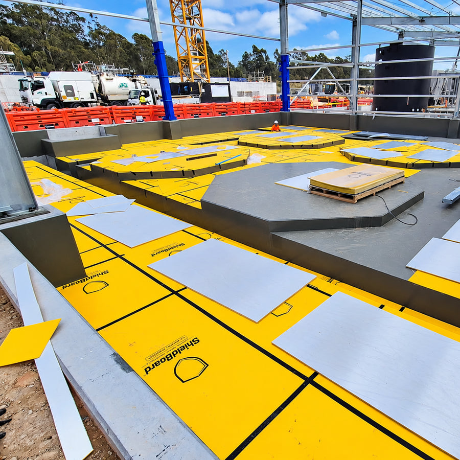 High-impact felt-backed yellow temporary surface protection board designed for sensitive flooring and lift interiors during construction.