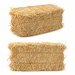 Erosion Control Straw Bales placed along a drainage boundary, demonstrating a temporary permeable silt barrier on an active building site.
