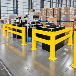 High-visibility modular pedestrian barrier system featuring yellow safety posts and horizontal rails for industrial walkway separation.