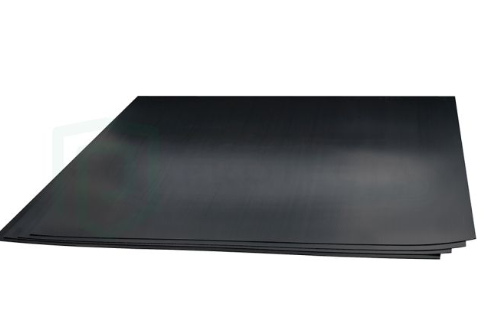 Scoring and cutting a 2.5mm black corflute sheet to size for custom surface protection during a construction renovation.