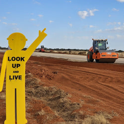 look up and live yellow man sign 
